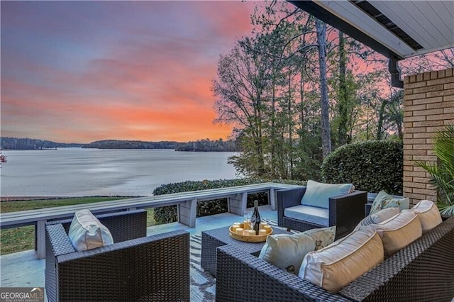 exterior space with a water view and an outdoor hangout area