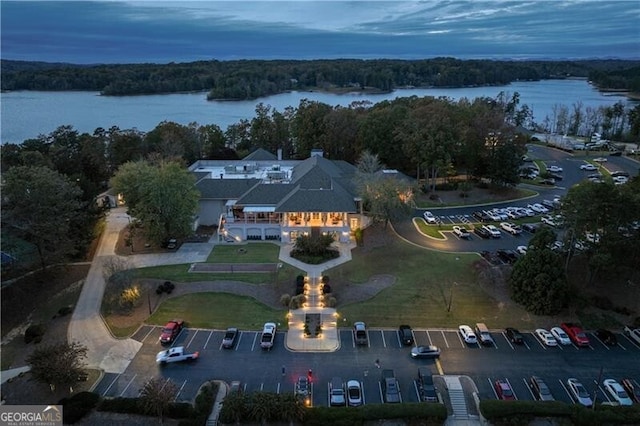 aerial view at dusk with a water view