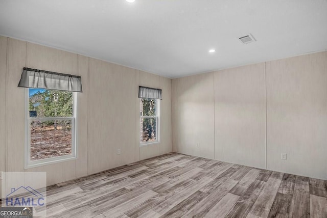 unfurnished room featuring light wood-type flooring