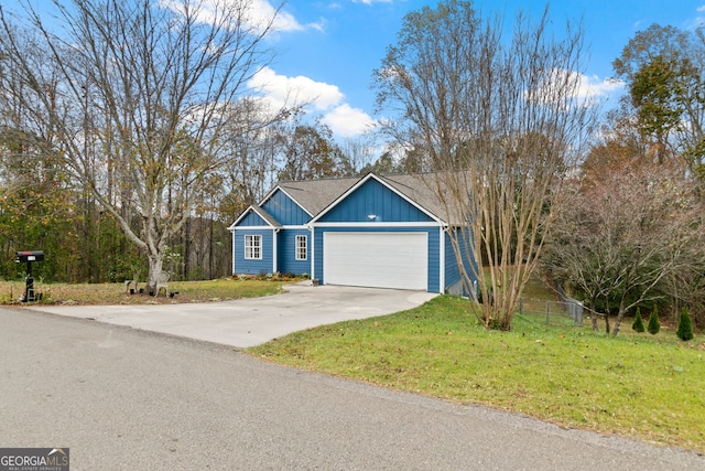 view of front facade featuring a front lawn and a garage