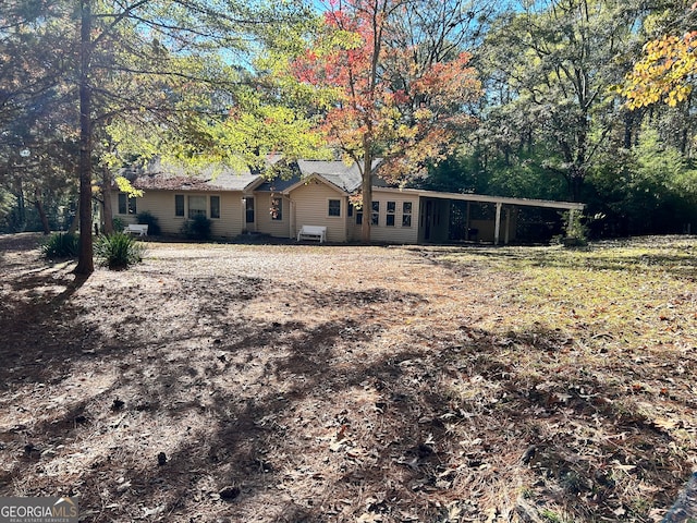 rear view of house with a carport