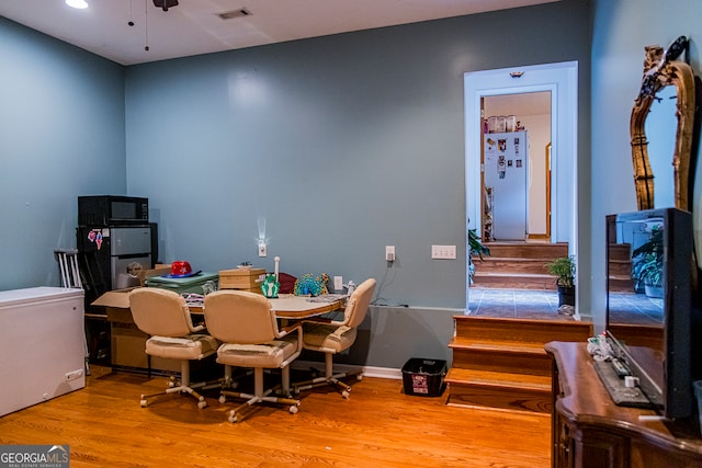 dining area featuring ceiling fan and light hardwood / wood-style flooring