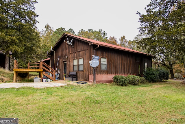 view of side of home featuring a yard