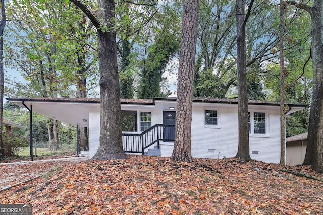 view of front of house featuring a carport