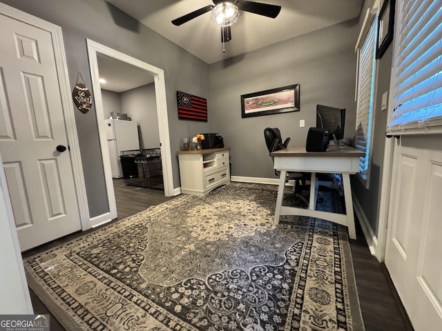 office with ceiling fan and dark wood-type flooring