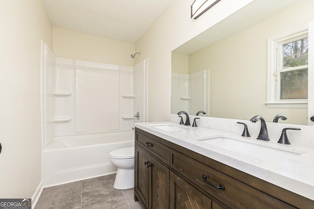 full bathroom featuring tub / shower combination, vanity, and toilet