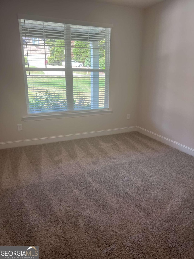 view of carpeted spare room