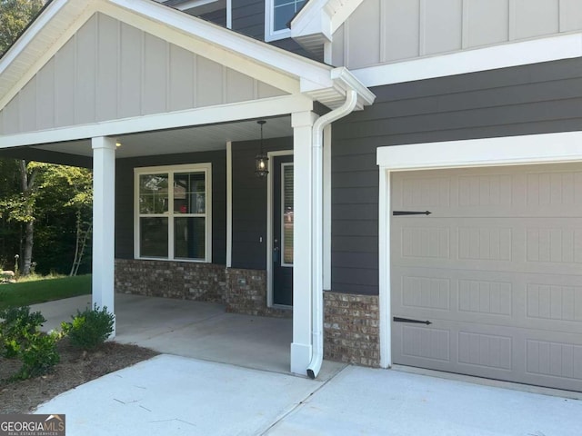 doorway to property with a garage