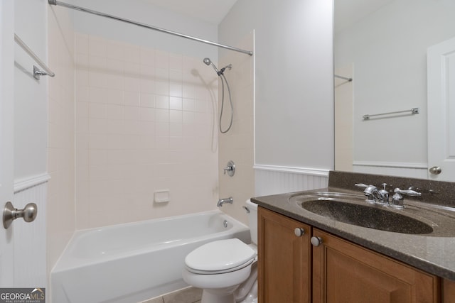 full bathroom with vanity, toilet, and tiled shower / bath