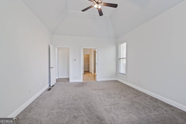 unfurnished bedroom featuring light carpet, high vaulted ceiling, and ceiling fan