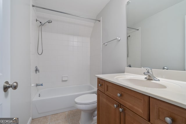 full bathroom with tile patterned floors, vanity, toilet, and tiled shower / bath combo