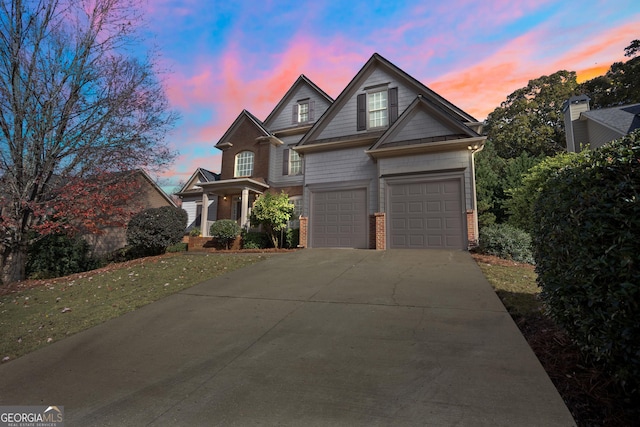 view of front facade featuring a yard and a garage