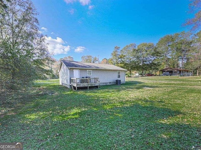 exterior space with a yard and a deck