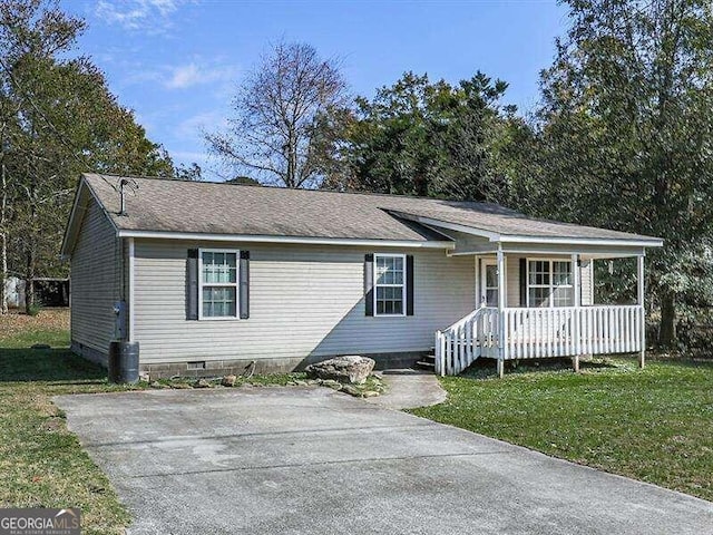 ranch-style home with a front yard and a porch