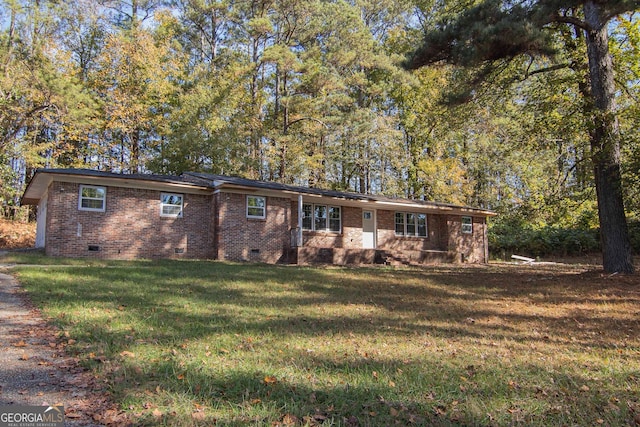 single story home featuring a front yard