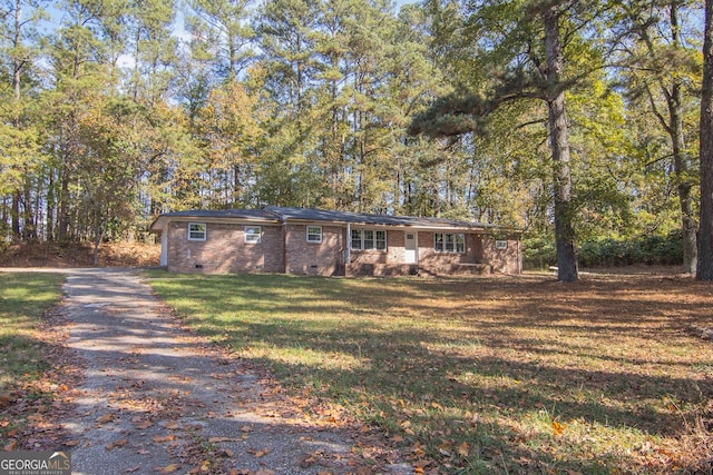 ranch-style home with a front yard