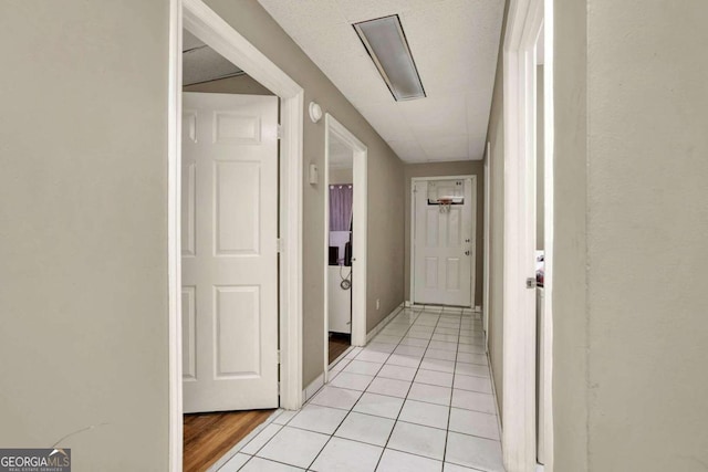 hallway with light tile patterned flooring