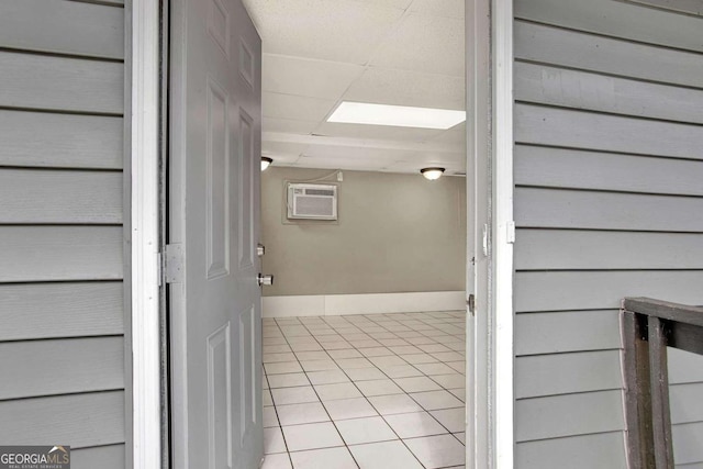 doorway to property with a wall mounted air conditioner