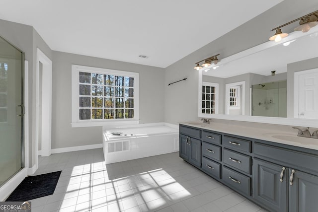 bathroom featuring tile patterned floors, separate shower and tub, and vanity