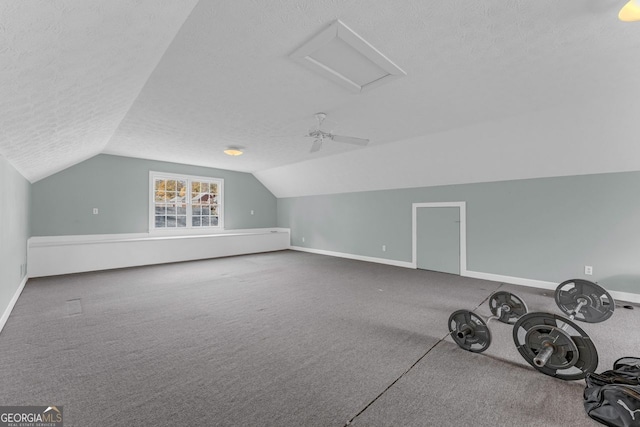 bonus room featuring carpet flooring, a textured ceiling, and vaulted ceiling