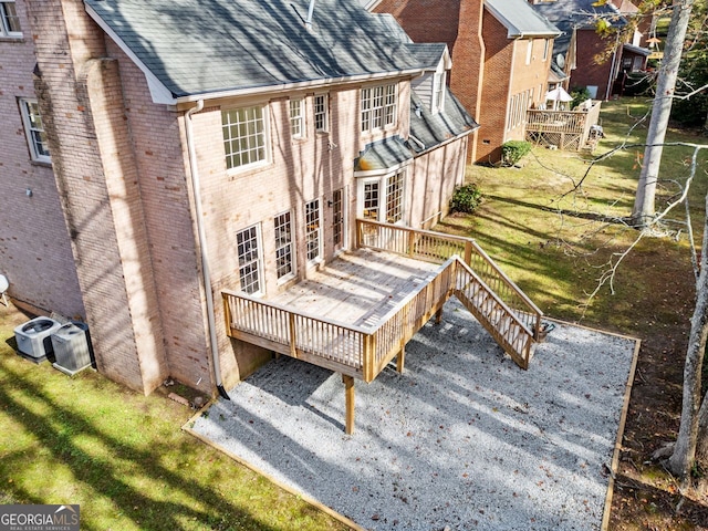 exterior space with a yard and a deck