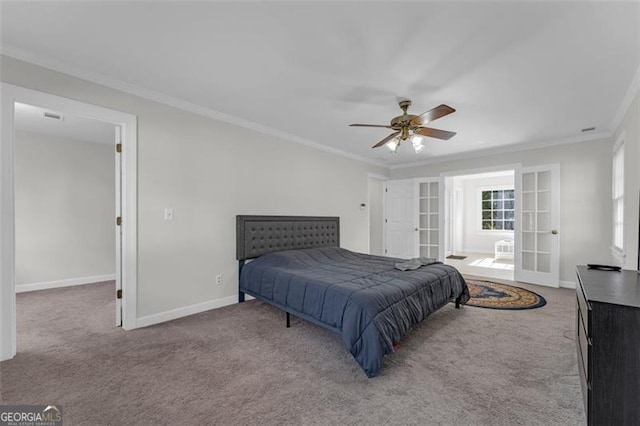 carpeted bedroom featuring french doors, ceiling fan, and crown molding