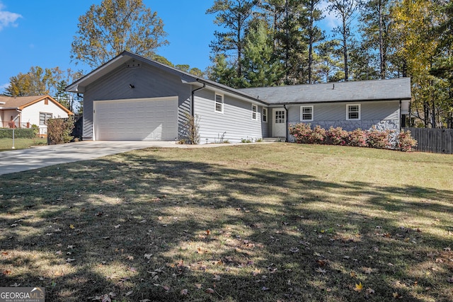 ranch-style home with a front yard and a garage