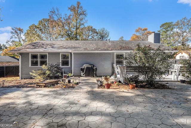 back of house featuring a patio