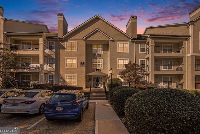 view of outdoor building at dusk