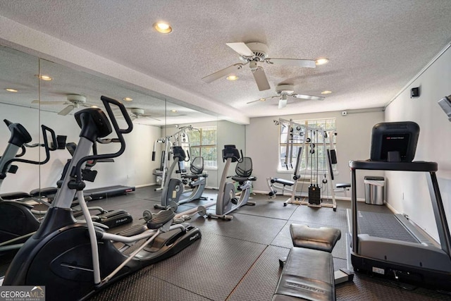 gym with ceiling fan and a textured ceiling