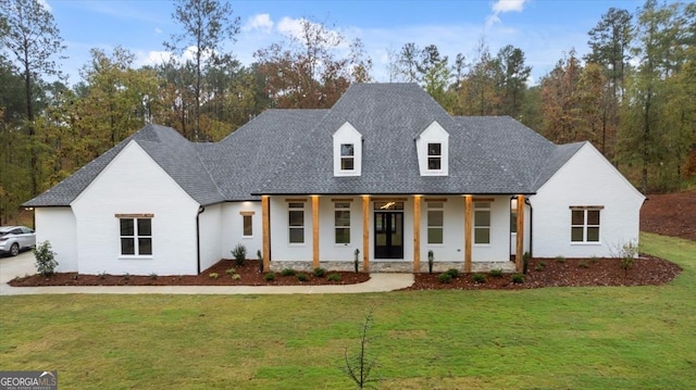 view of front of home featuring a front lawn and a porch