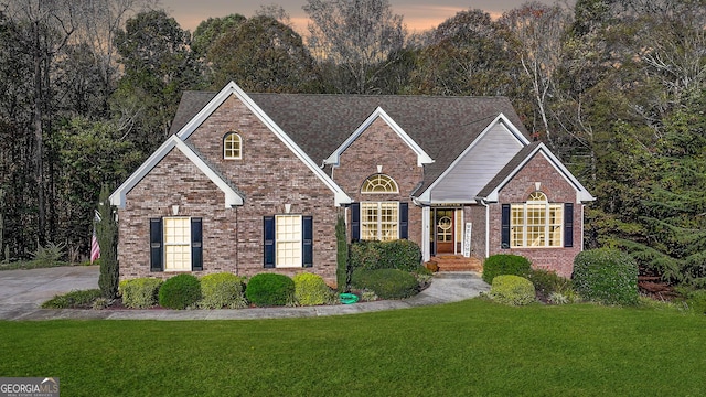 view of front of property with a yard