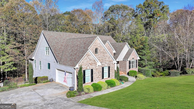 view of front of home featuring a garage and a front yard