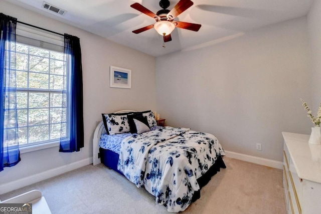 carpeted bedroom with ceiling fan