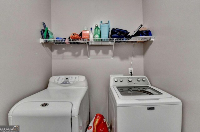 laundry room with washer and dryer