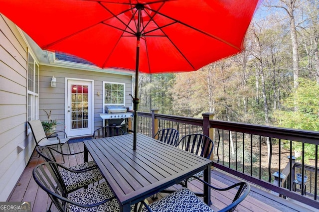 wooden deck with area for grilling