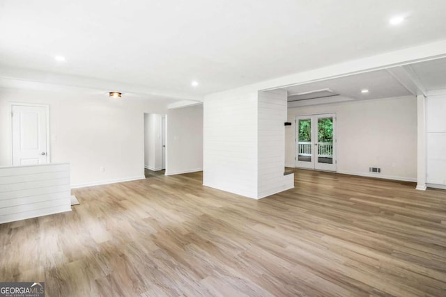 unfurnished living room with light hardwood / wood-style floors