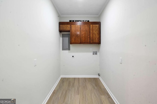 clothes washing area with light wood-type flooring, washer hookup, crown molding, and electric dryer hookup