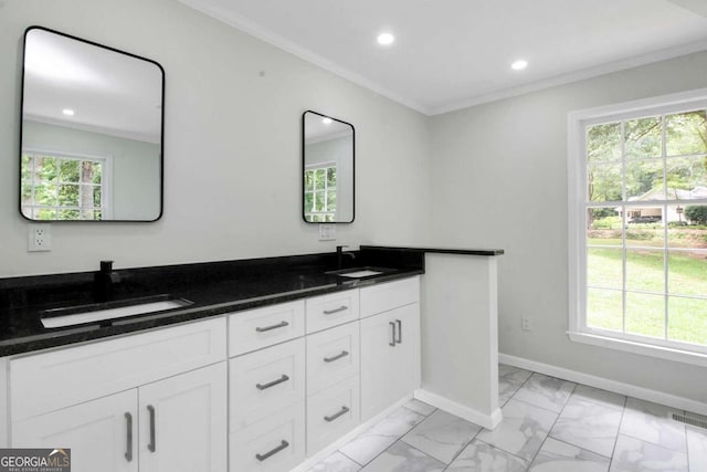 bathroom with vanity and ornamental molding