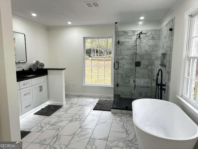 bathroom featuring ornamental molding, shower with separate bathtub, and vanity