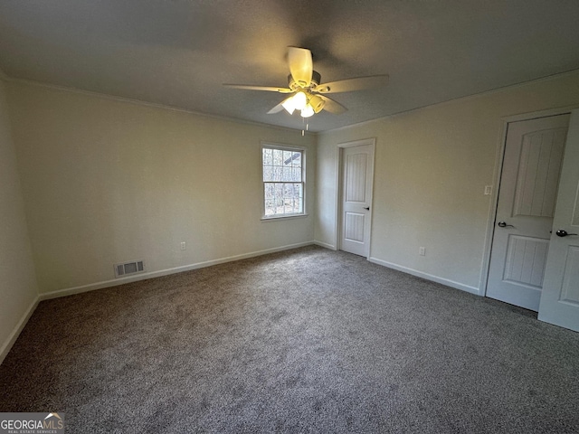 unfurnished bedroom featuring a ceiling fan, baseboards, visible vents, and carpet flooring