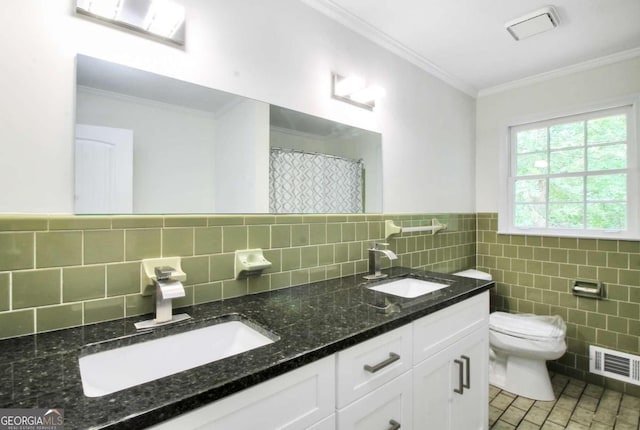 bathroom featuring tasteful backsplash, vanity, tile walls, toilet, and tile patterned floors