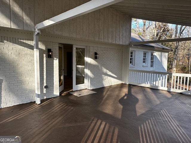 wooden deck with a patio