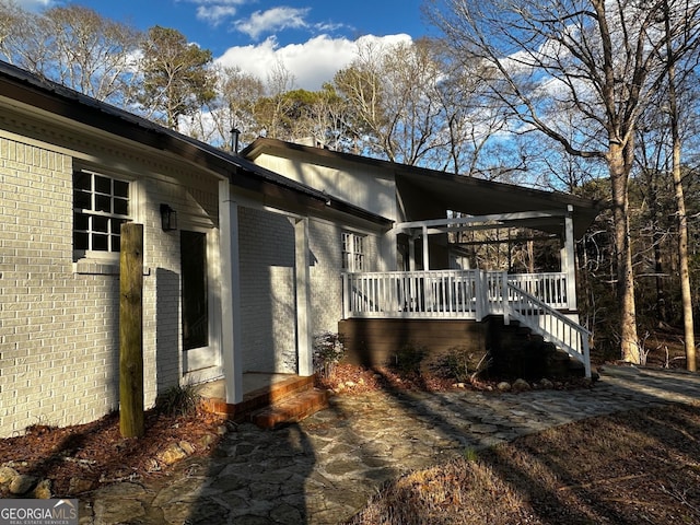 view of side of property with brick siding