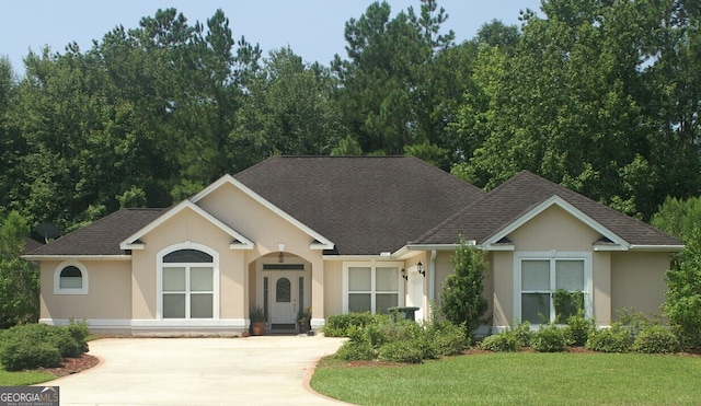 ranch-style house with a front lawn