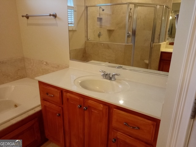 bathroom featuring vanity and an enclosed shower