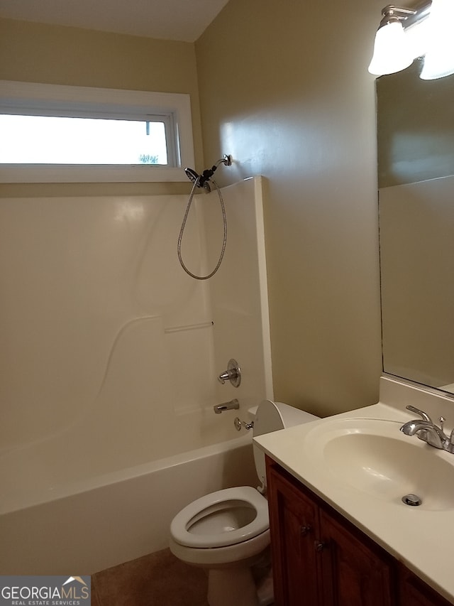 full bathroom featuring tile patterned floors, vanity, toilet, and shower / bathtub combination