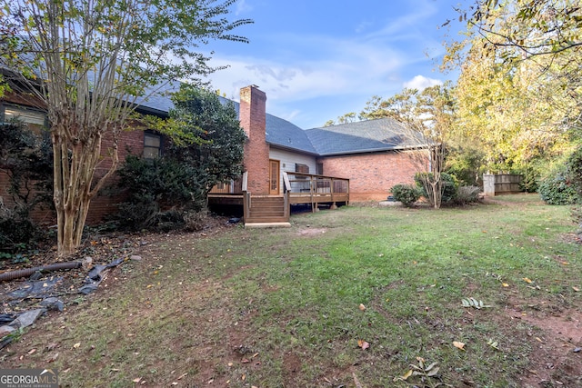 view of yard with a wooden deck