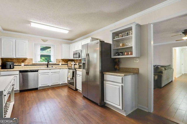 kitchen featuring white cabinets, dark hardwood / wood-style floors, sink, and stainless steel appliances