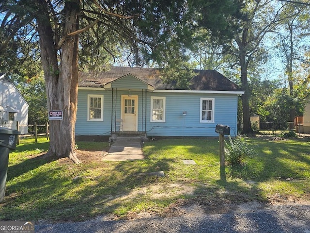 ranch-style house with a front yard